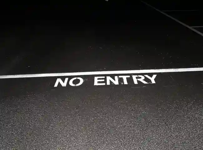 white road marking no entry dark asphalt by car park line marking company