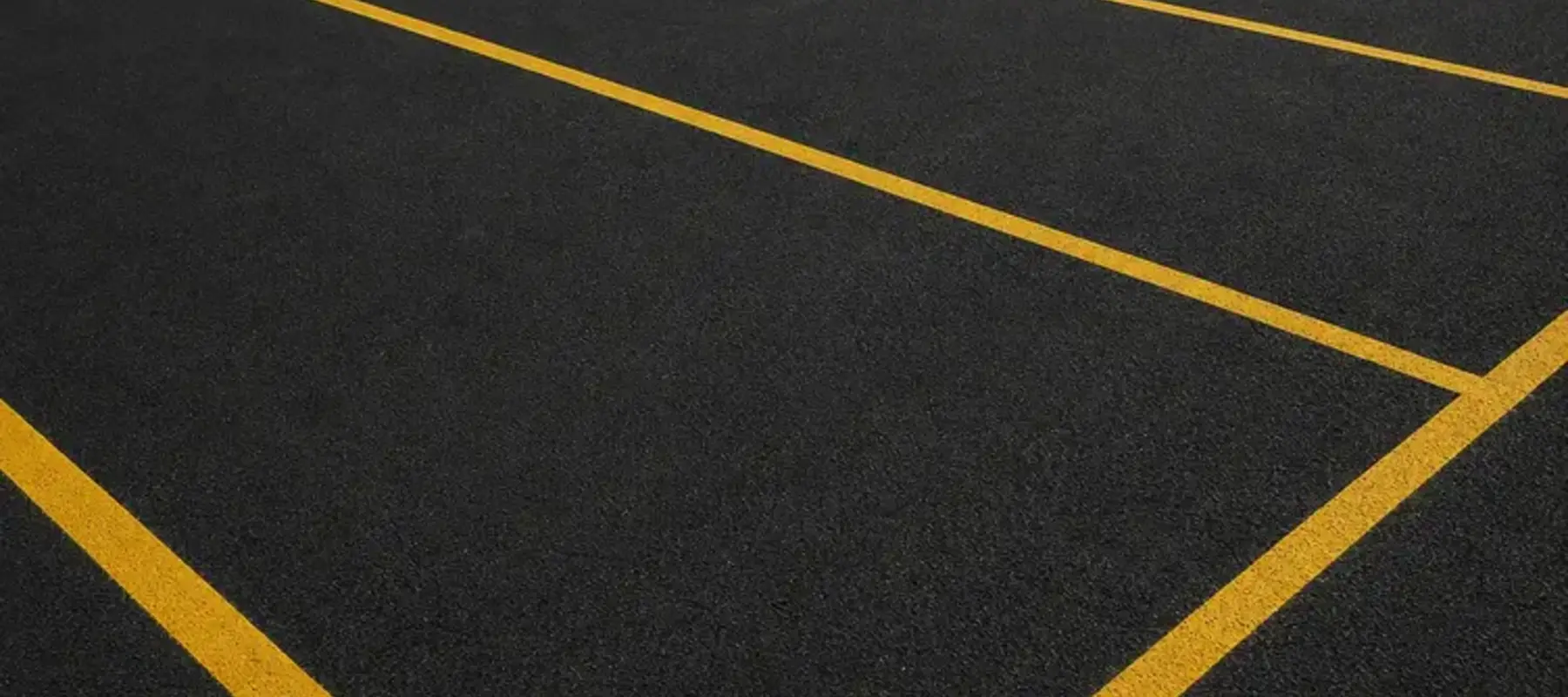Yellow car park lines that adhere to UK line marking regulations
